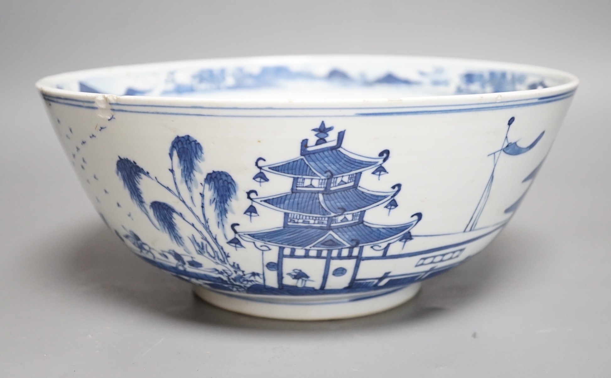 A 19th century Chinese blue and white landscape bowl, 26cm